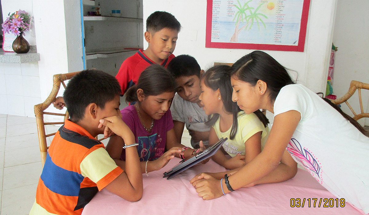The Kids playing Math Games on an iPad - Marsh Children's Home Events